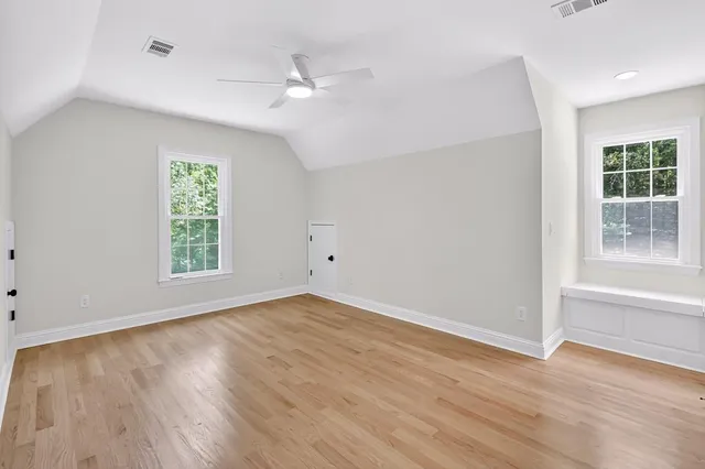 a view of livingroom with wooden floor and flat screen tv