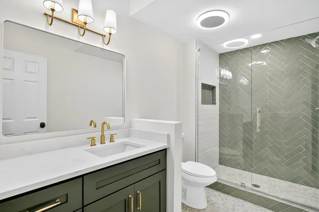 a front view of house with a garden and patio