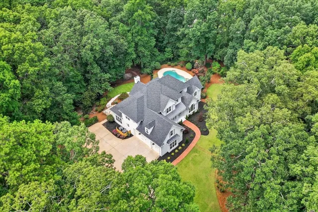 a view of a swimming pool with a patio
