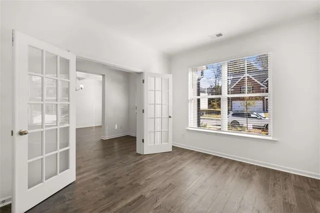 a large kitchen with stainless steel appliances kitchen island a large counter top and cabinets