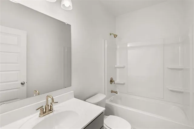 a white bath tub sitting next to a window