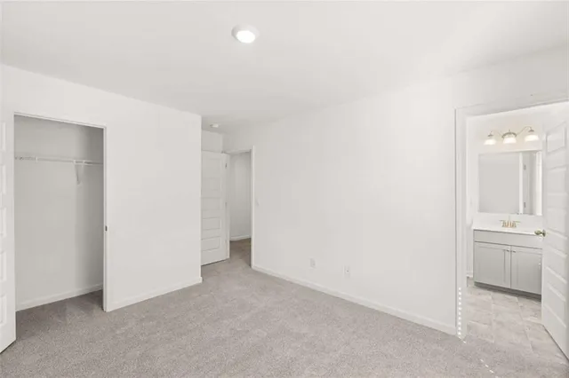 an aerial view of a swimming pool with outdoor seating and yard