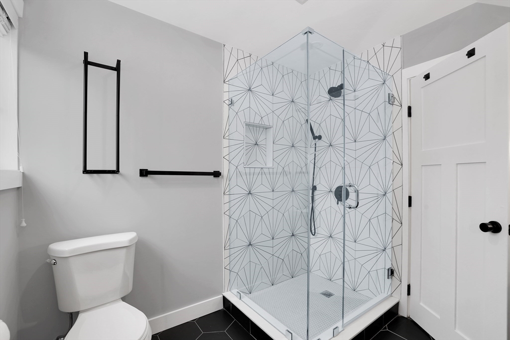 34 Temple Street Boston, MA 02126 - Photo 25 of 38 a bathroom with a toilet and shower
