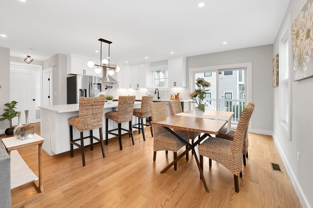 34 Temple Street Boston, MA 02126 - Photo 5 of 38 a view of a dining room with furniture and wooden floor
