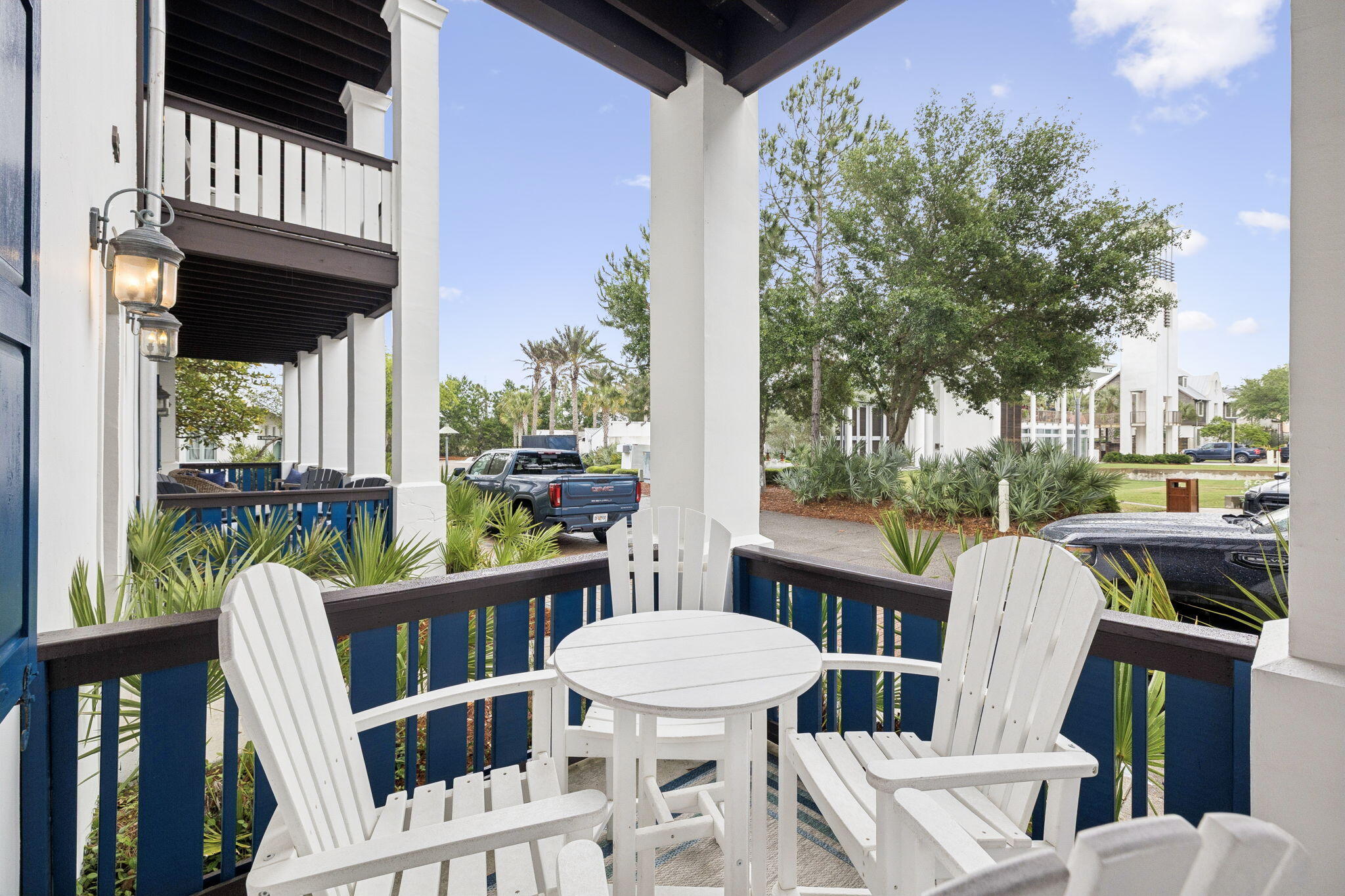 45 St Augustine Street, Unit 9101 Inlet Beach, FL 32461 - Photo 30 of 32 a view of a balcony with chairs and a table