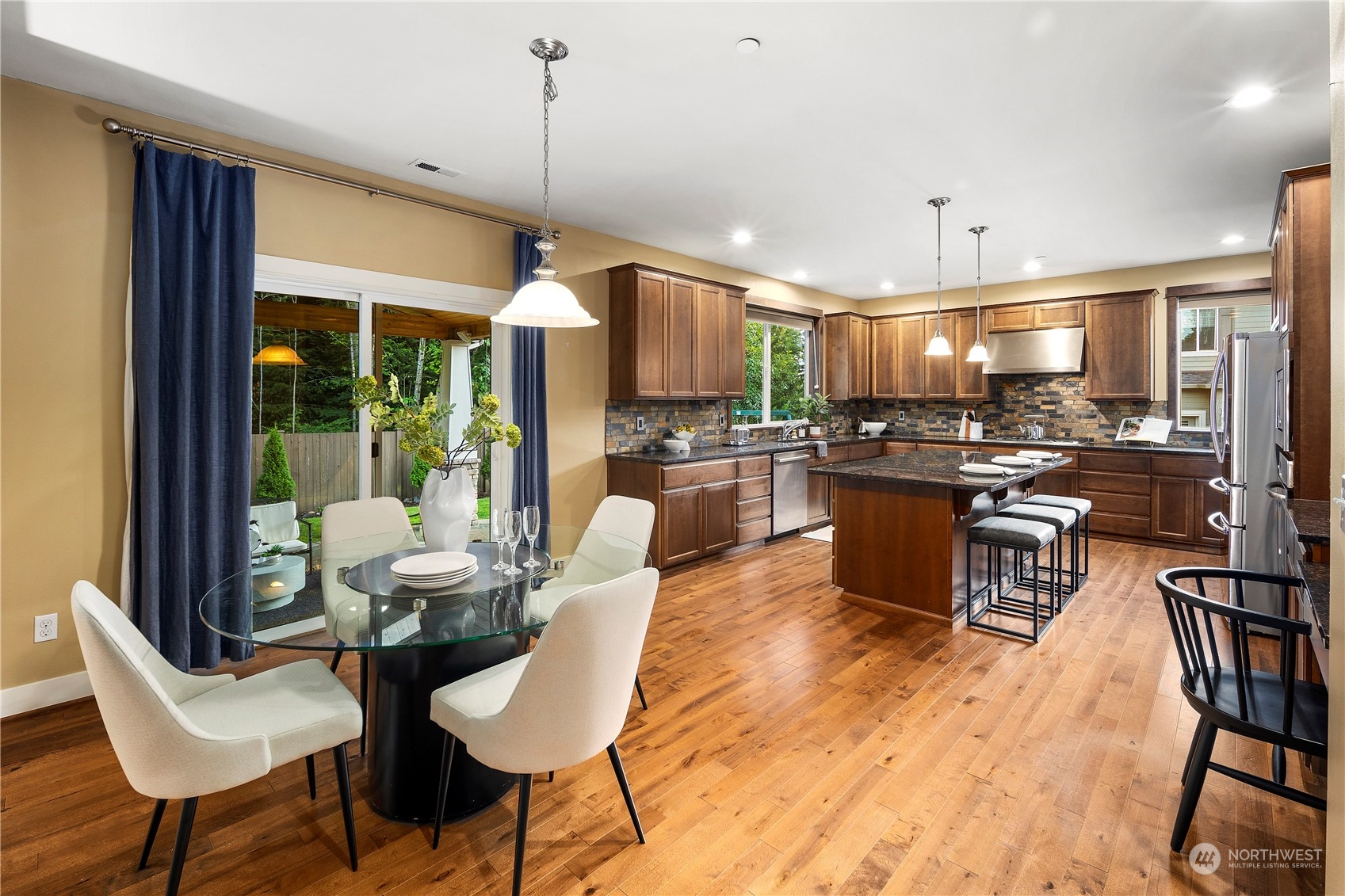3412 223rd Place Southeast Bothell, WA 98021 - Photo 18 of 40 a large kitchen with a table and chairs