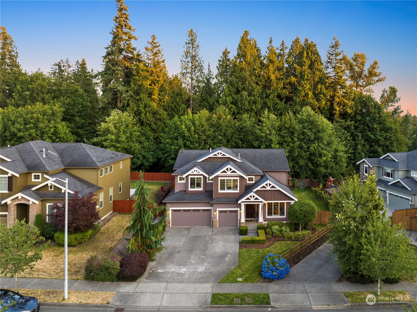 3412 223rd Place Southeast Bothell, WA 98021 - Photo 3 of 40 a front view of a house with a garden