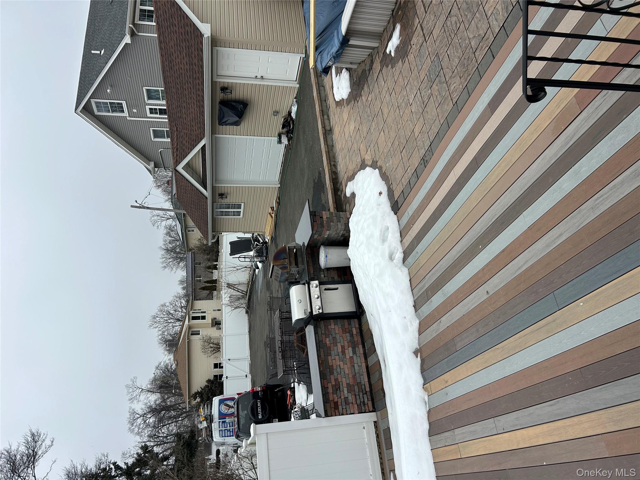 869 Demott Avenue Baldwin, NY 11510 - Photo 3 of 15 a view of a house with a terrace