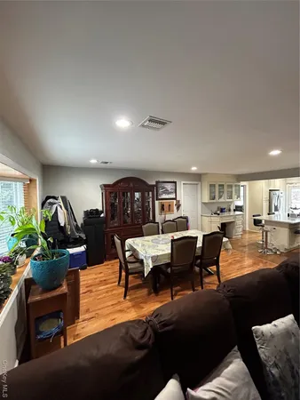 a living room with furniture and a piano