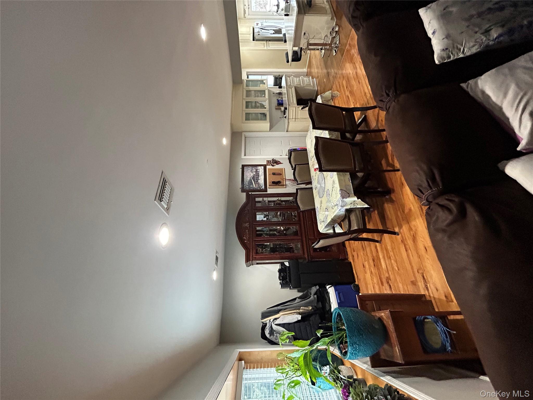 869 Demott Avenue Baldwin, NY 11510 - Photo 8 of 15 a living room with furniture and a piano