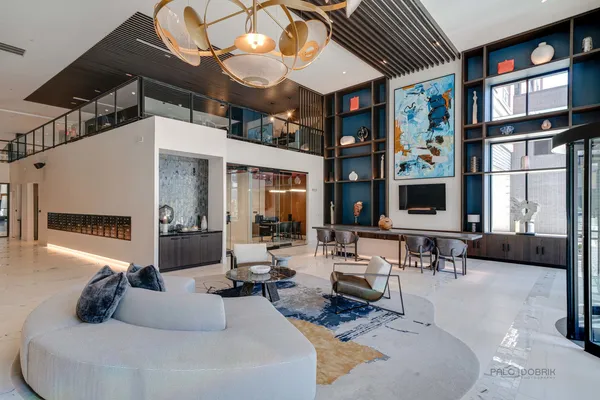 a living room with furniture a window and flat screen tv