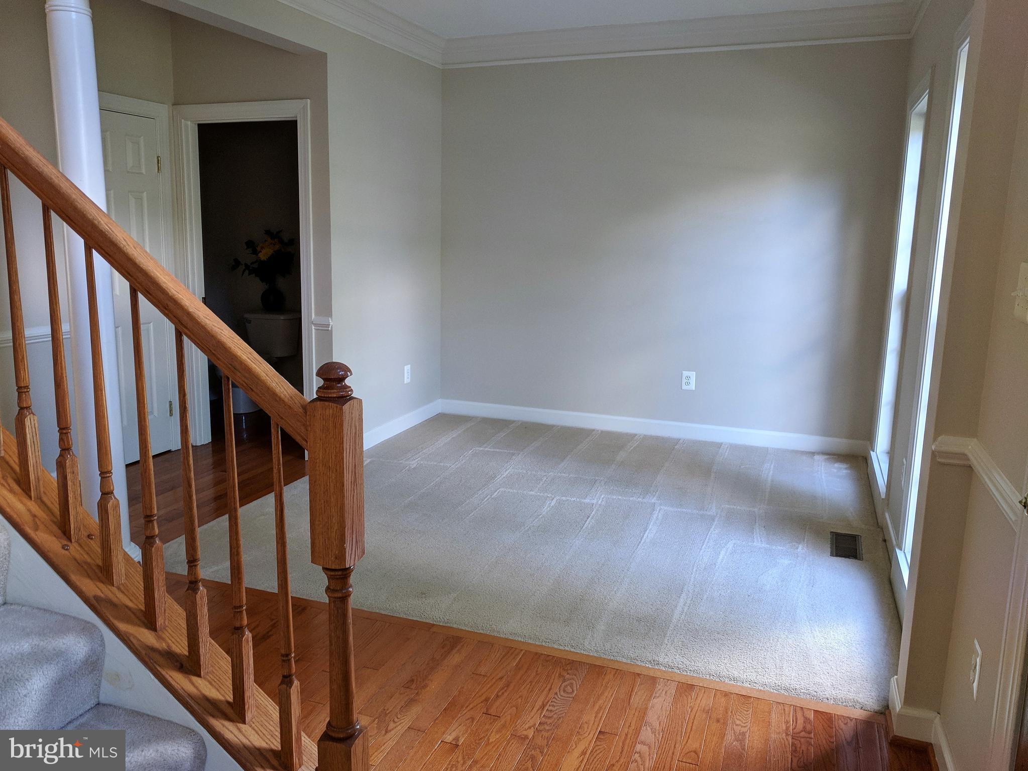 Formal living room with crown molding.
