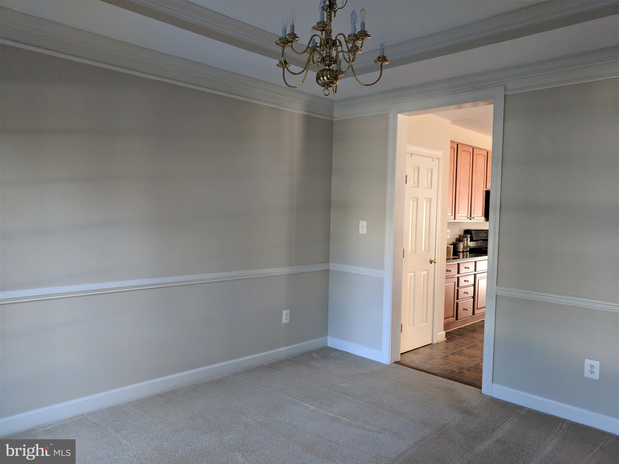 Tray ceiling, crown and chair rail in dining room.