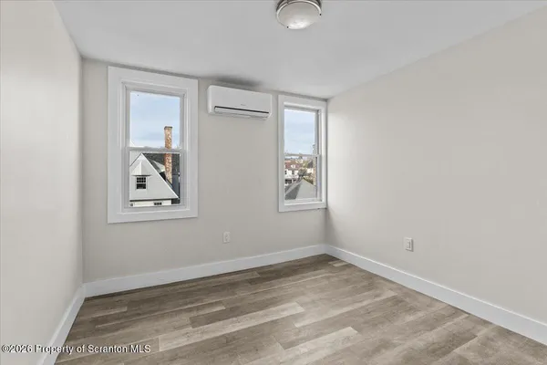 an empty room with windows