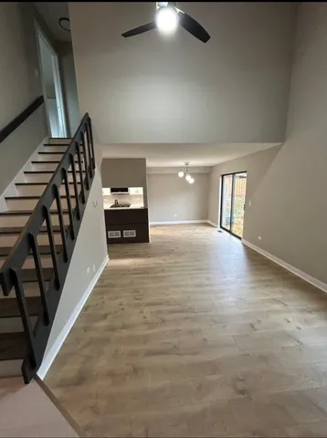 a view of an empty room and wooden floor