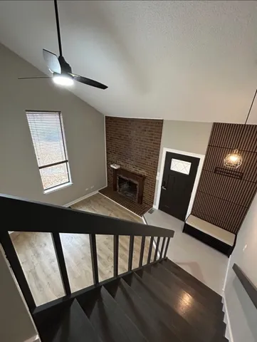 a balcony view with chairs and wooden floor