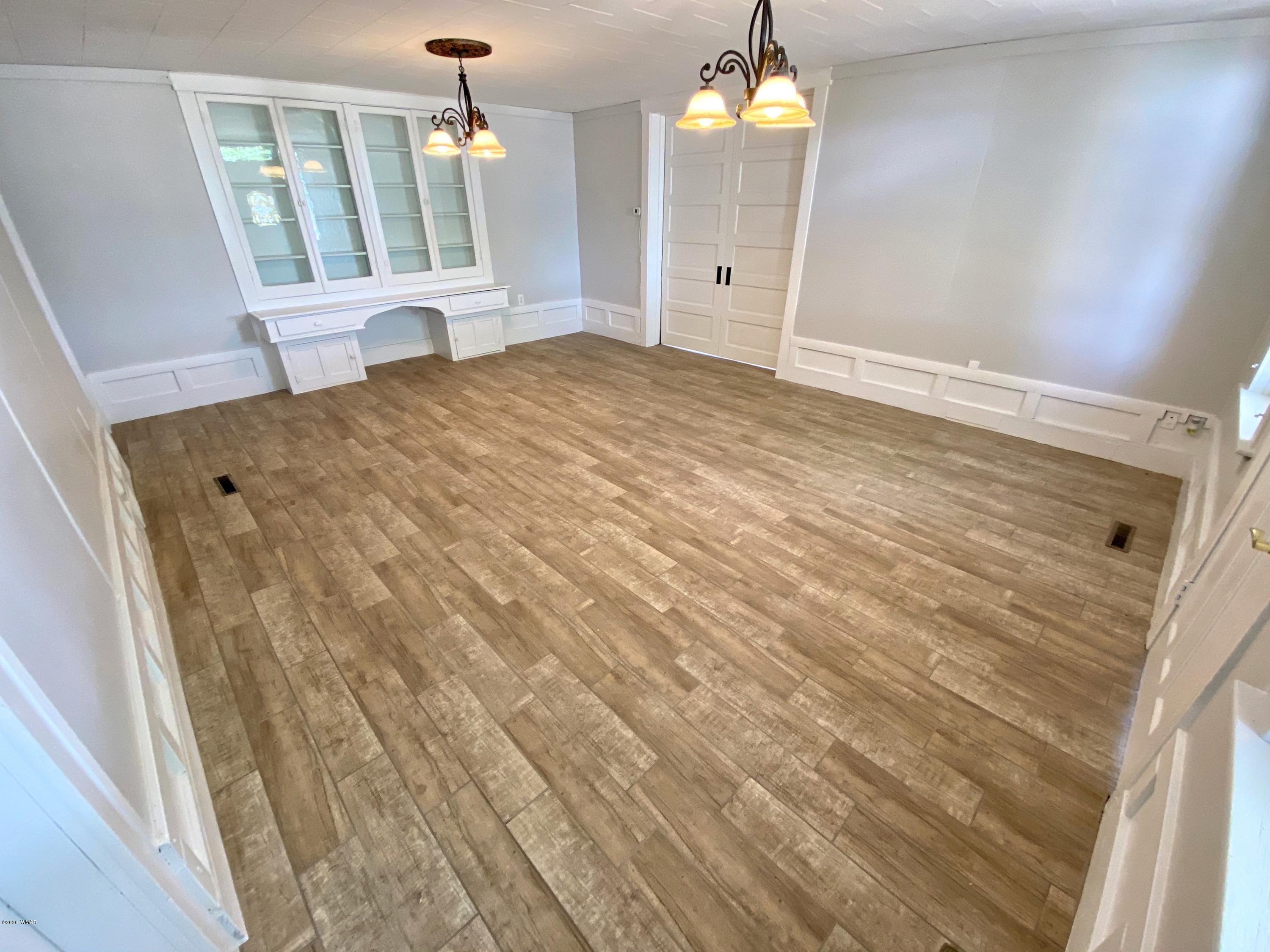 370 South 3rd Street West Snowflake, AZ 85937 - Photo 11 of 53 a view of a bedroom with wooden floor and windows