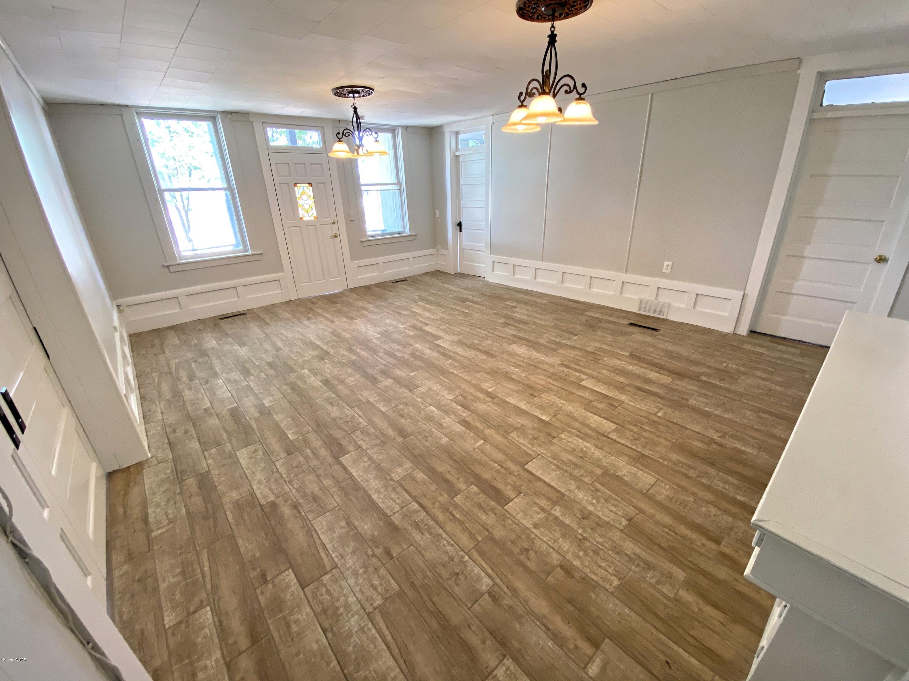 370 South 3rd Street West Snowflake, AZ 85937 - Photo 12 of 53 wooden floor in an empty room with a window