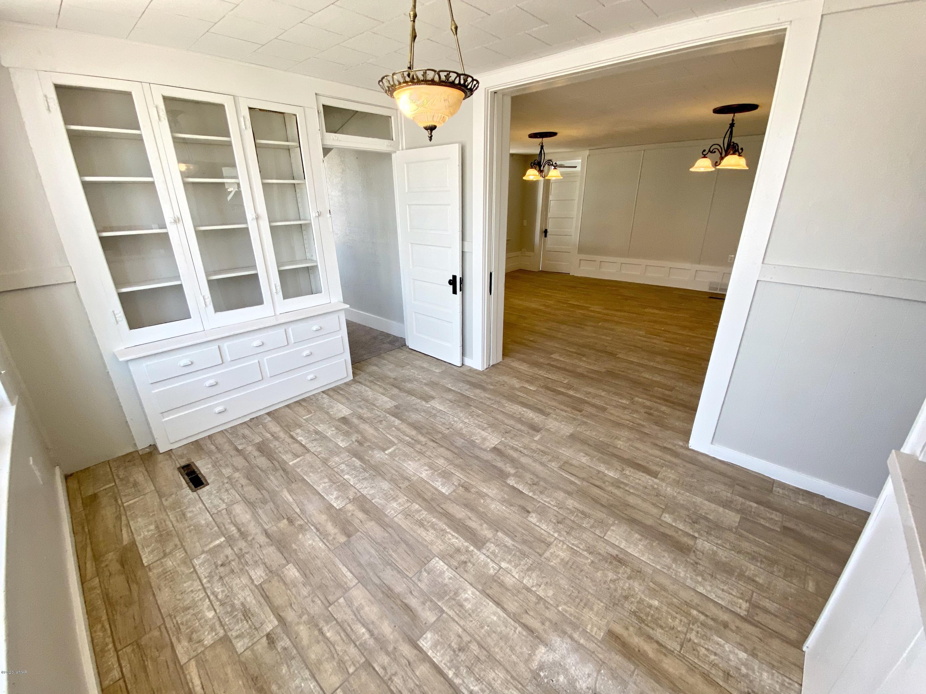 370 South 3rd Street West Snowflake, AZ 85937 - Photo 16 of 53 a view of wooden floor and windows in a room