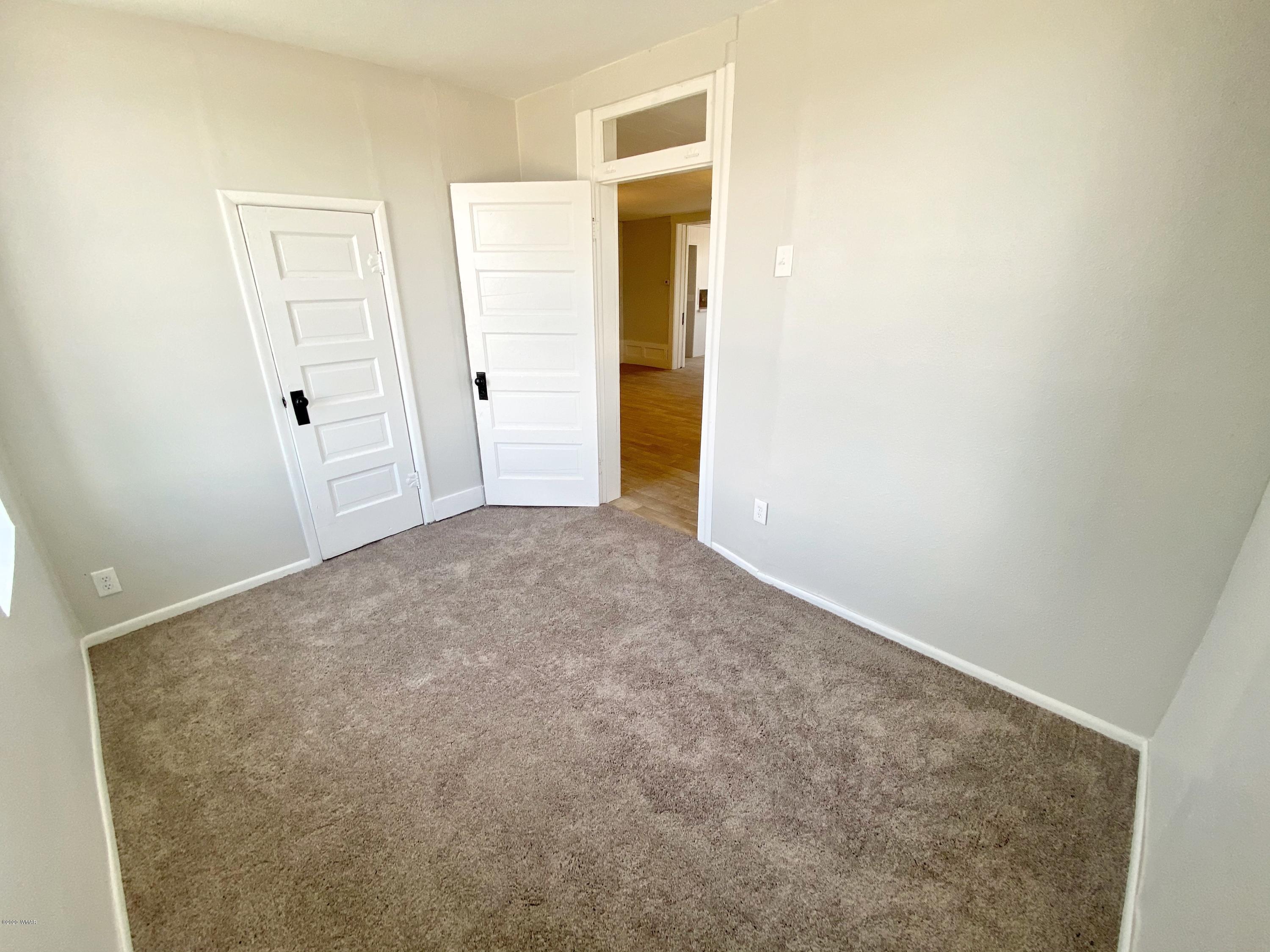 370 South 3rd Street West Snowflake, AZ 85937 - Photo 29 of 53 an empty room with an entrance to other room