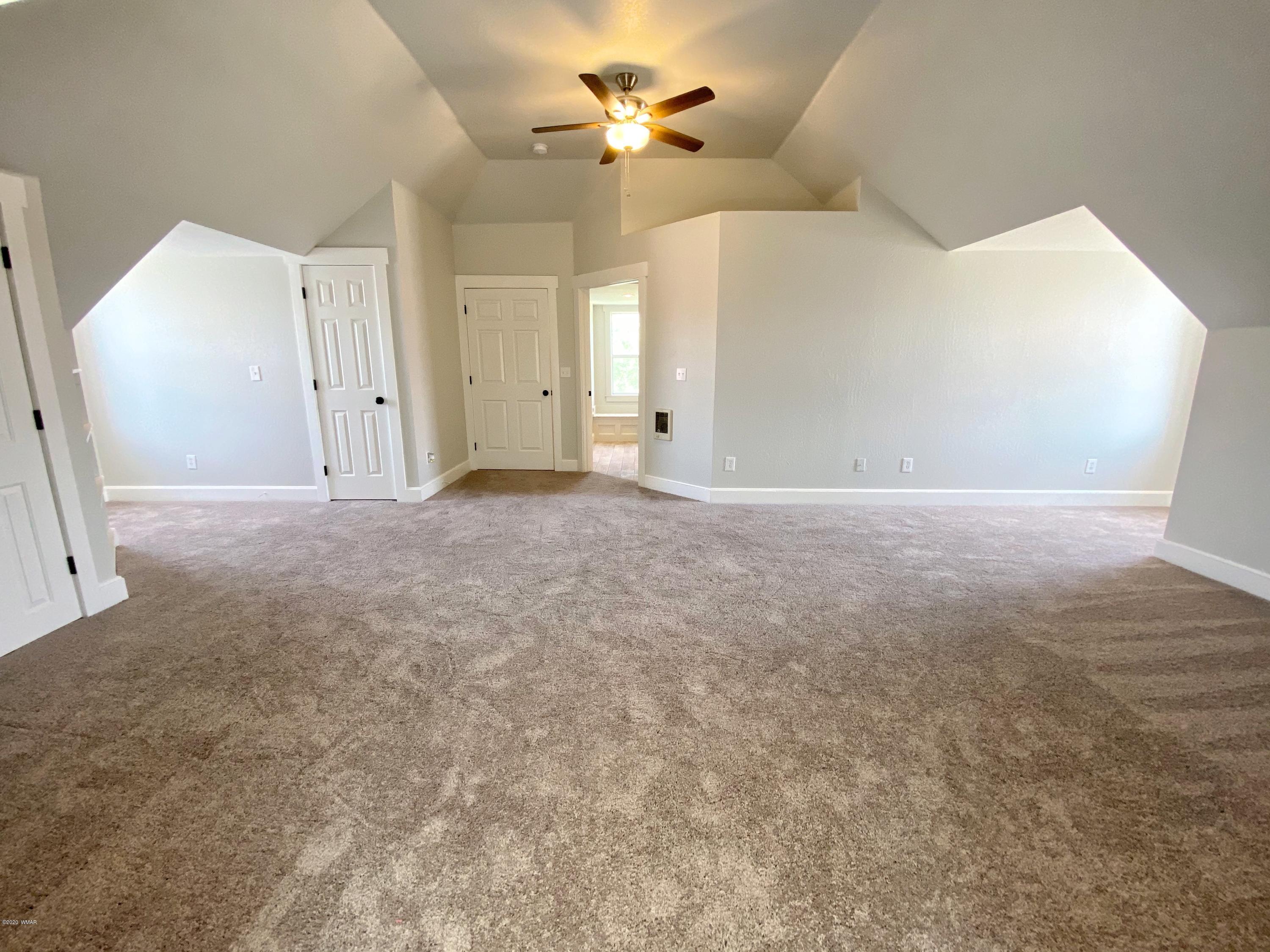 370 South 3rd Street West Snowflake, AZ 85937 - Photo 34 of 53 an empty room with ceiling fan and window