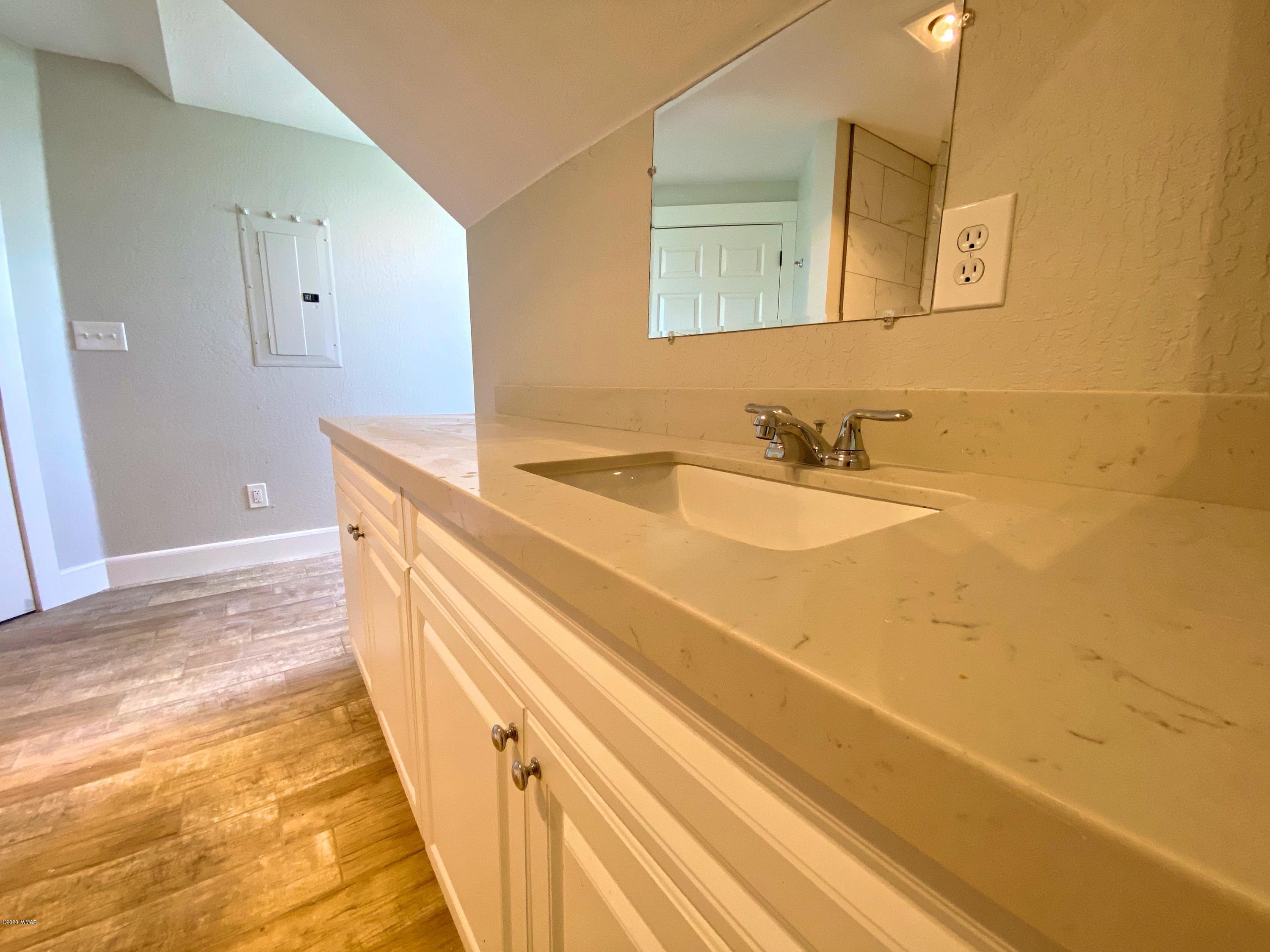 370 South 3rd Street West Snowflake, AZ 85937 - Photo 43 of 53 a bathroom with a sink and a mirror