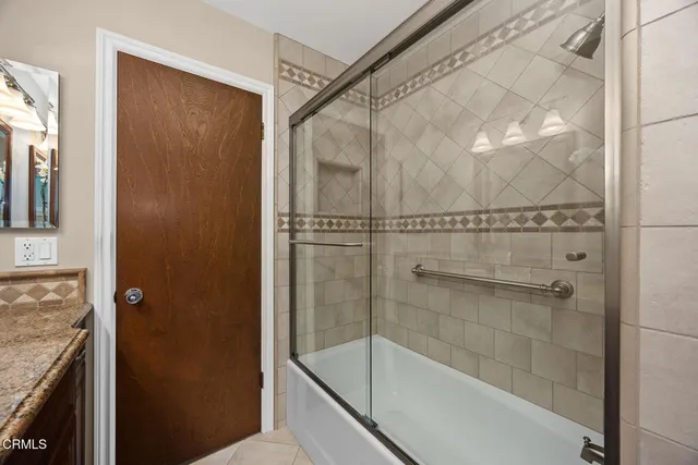 a bedroom with a bed and lamp