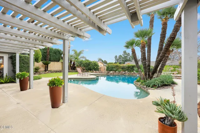 a view of a swimming pool with a lounge chair