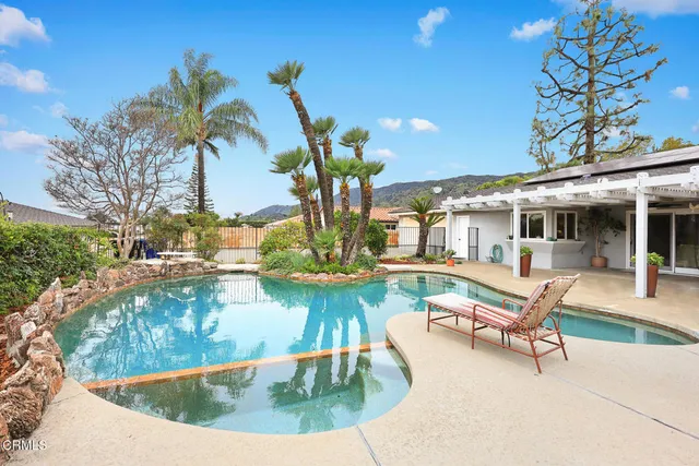a view of a swimming pool with a patio