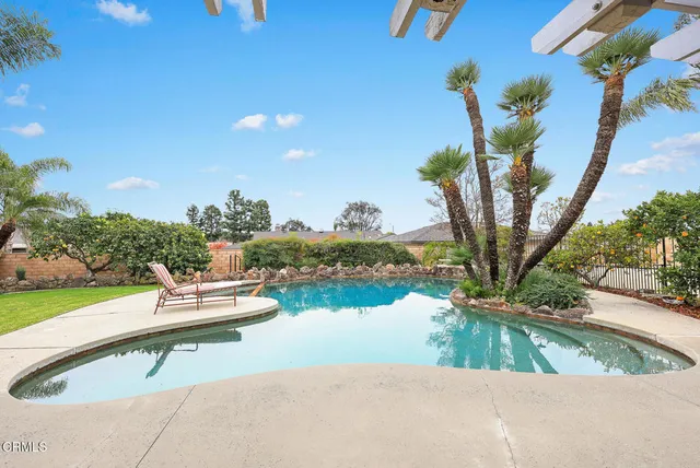 a view of a swimming pool with a patio