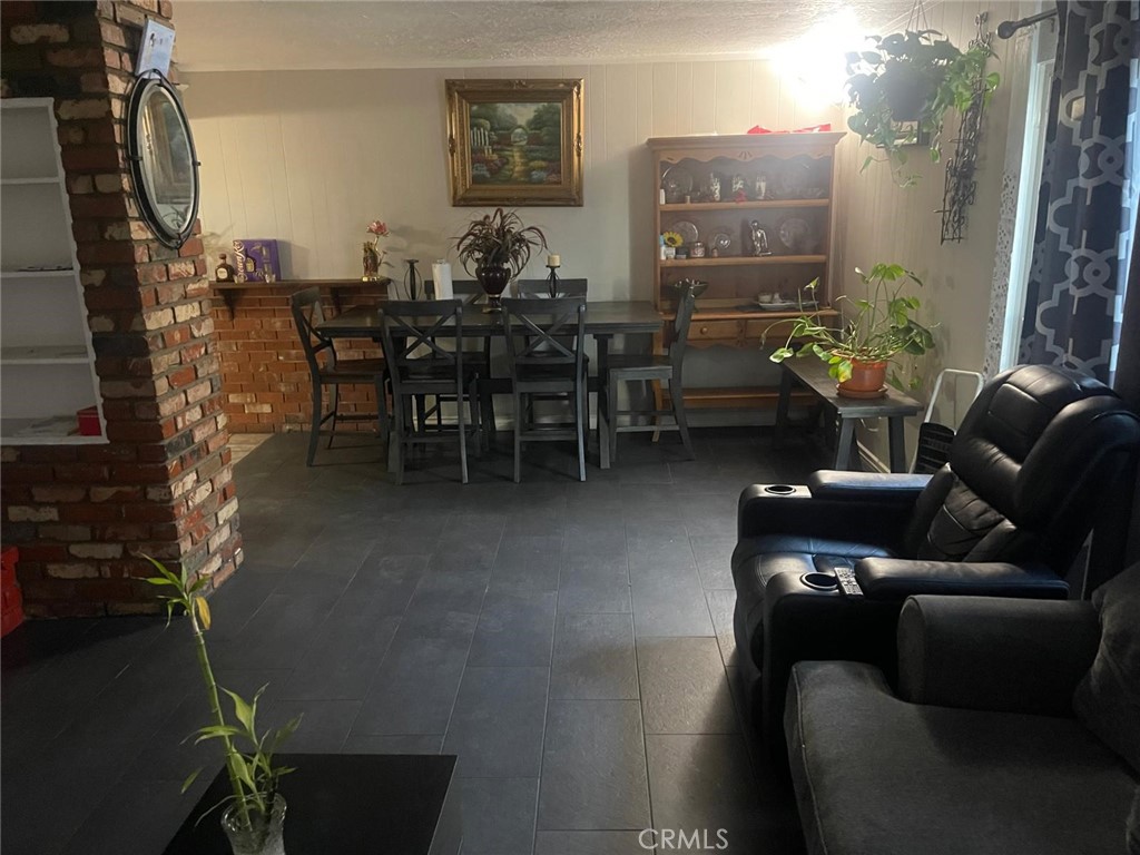 10450 Gramercy Place Riverside, CA 92505 - Photo 4 of 10 a living room with furniture and wooden floor