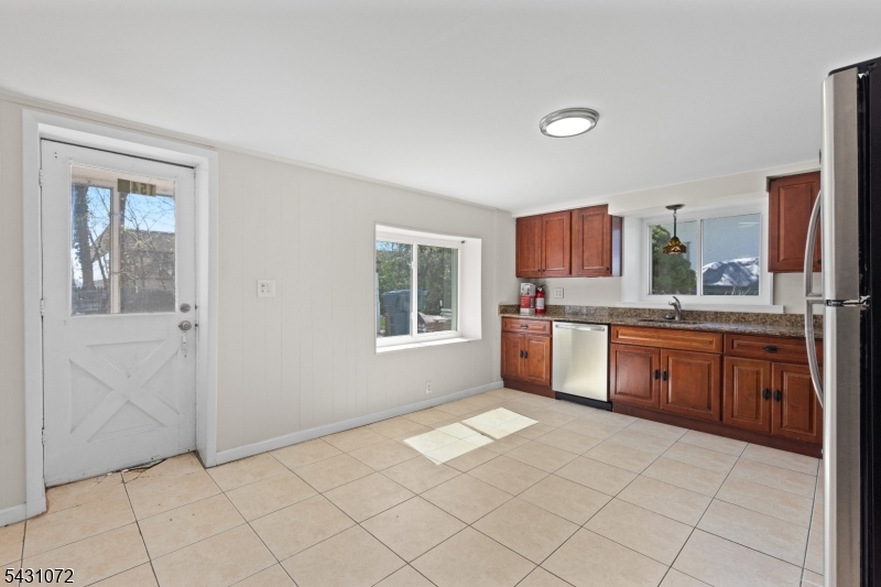 154 Ames Street Hackensack, NJ 07601 - Photo 2 of 12 a kitchen with stainless steel appliances a sink and cabinets