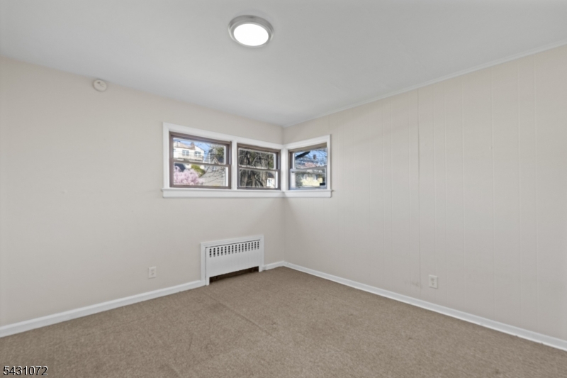154 Ames Street Hackensack, NJ 07601 - Photo 7 of 12 an empty room with windows