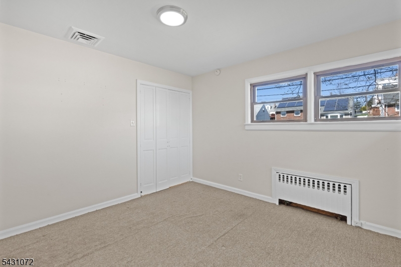 154 Ames Street Hackensack, NJ 07601 - Photo 8 of 12 a view of livingroom with furniture and window