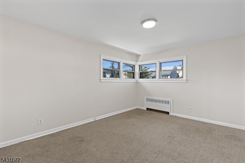 154 Ames Street Hackensack, NJ 07601 - Photo 9 of 12 an empty room with windows
