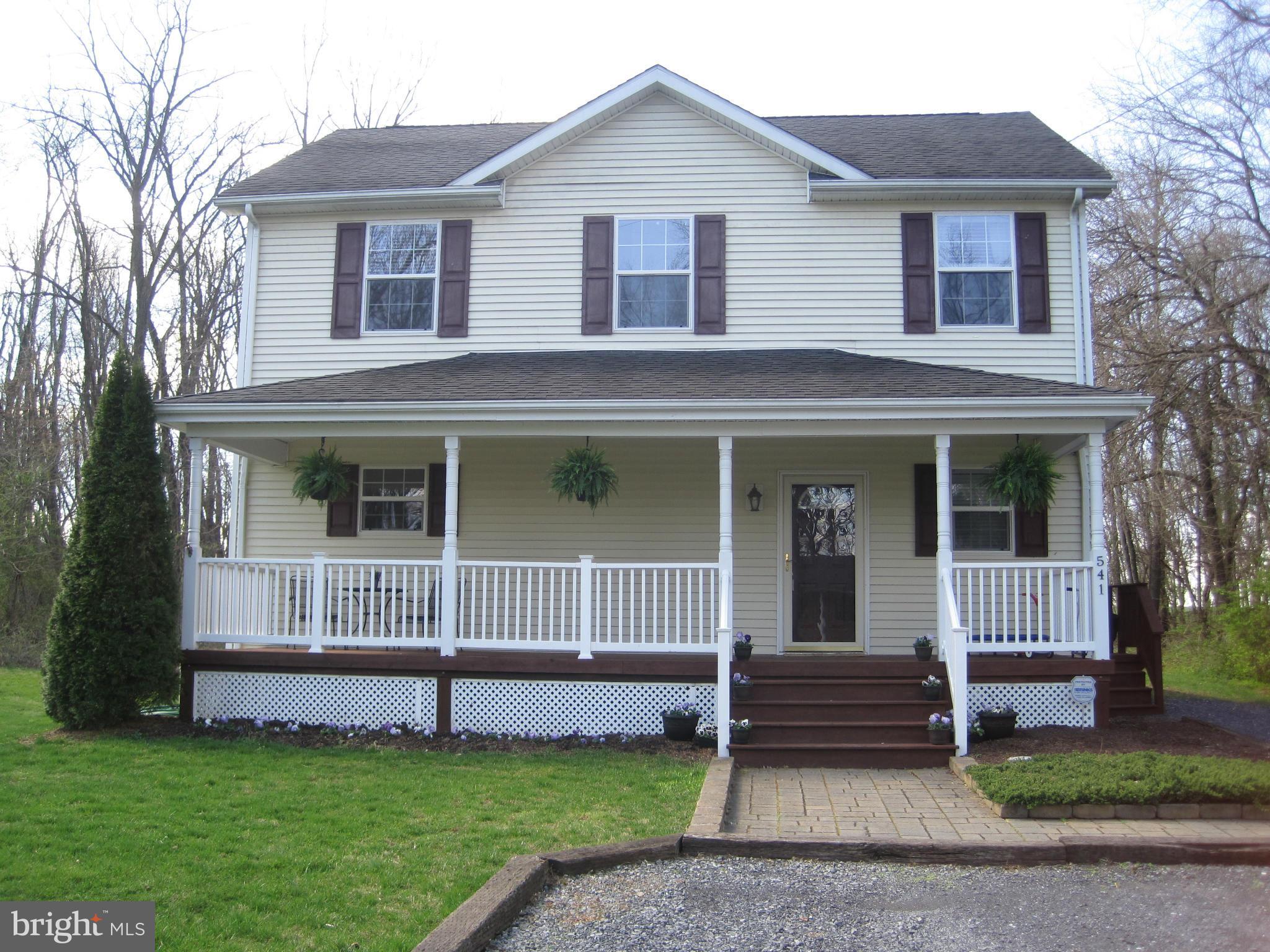 541 Stringtown Road Berryville, VA 22611 - Photo 1 of 19 a front view of a house with a garden