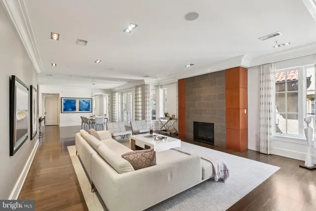 a living room with furniture fireplace and flat screen tv