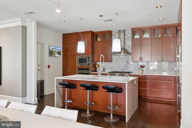 a kitchen with a stove a sink and a refrigerator