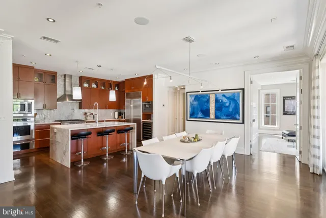 a view of a dining room with furniture and wooden floor