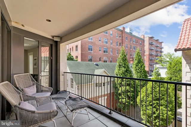 a view of a balcony with furniture
