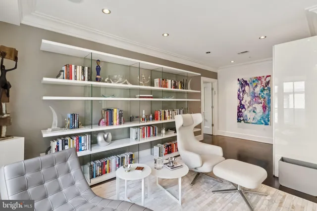 a living room with furniture cabinets and a shelf