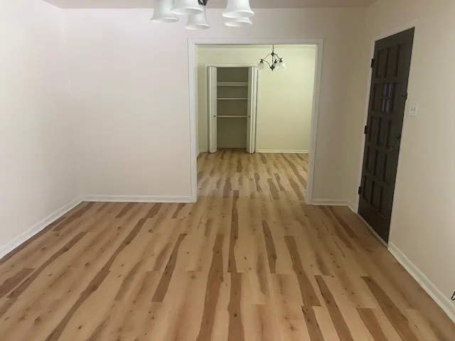 a view of a backyard with table and chairs and wooden fence