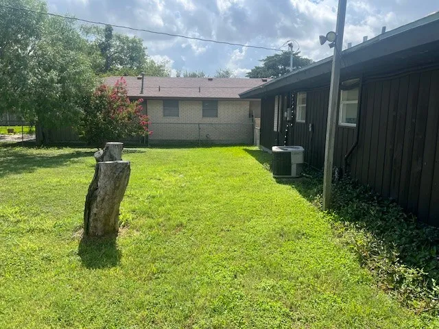 a view of a park with large trees