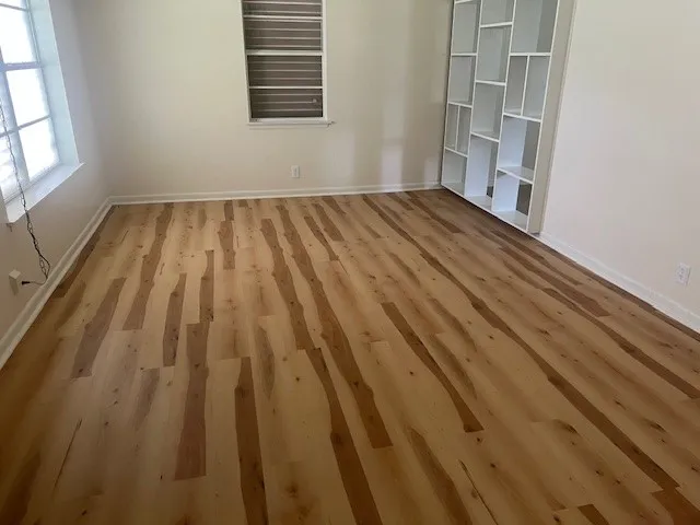 a view of wooden floor in an empty room