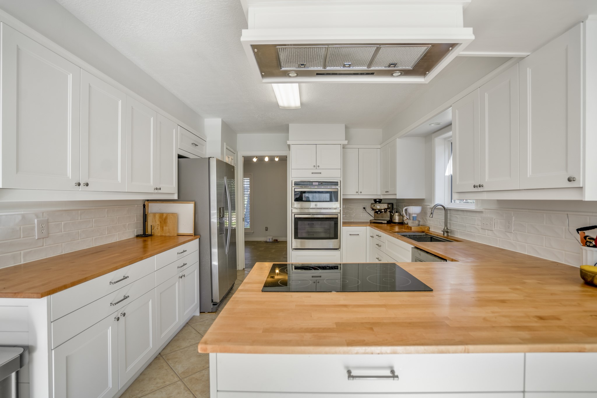 9507 Godstone Lane Spring, TX 77379 - Photo 11 of 42 The kitchen! You'll enjoy the generous counter space, fantastic storage, and new appliances.