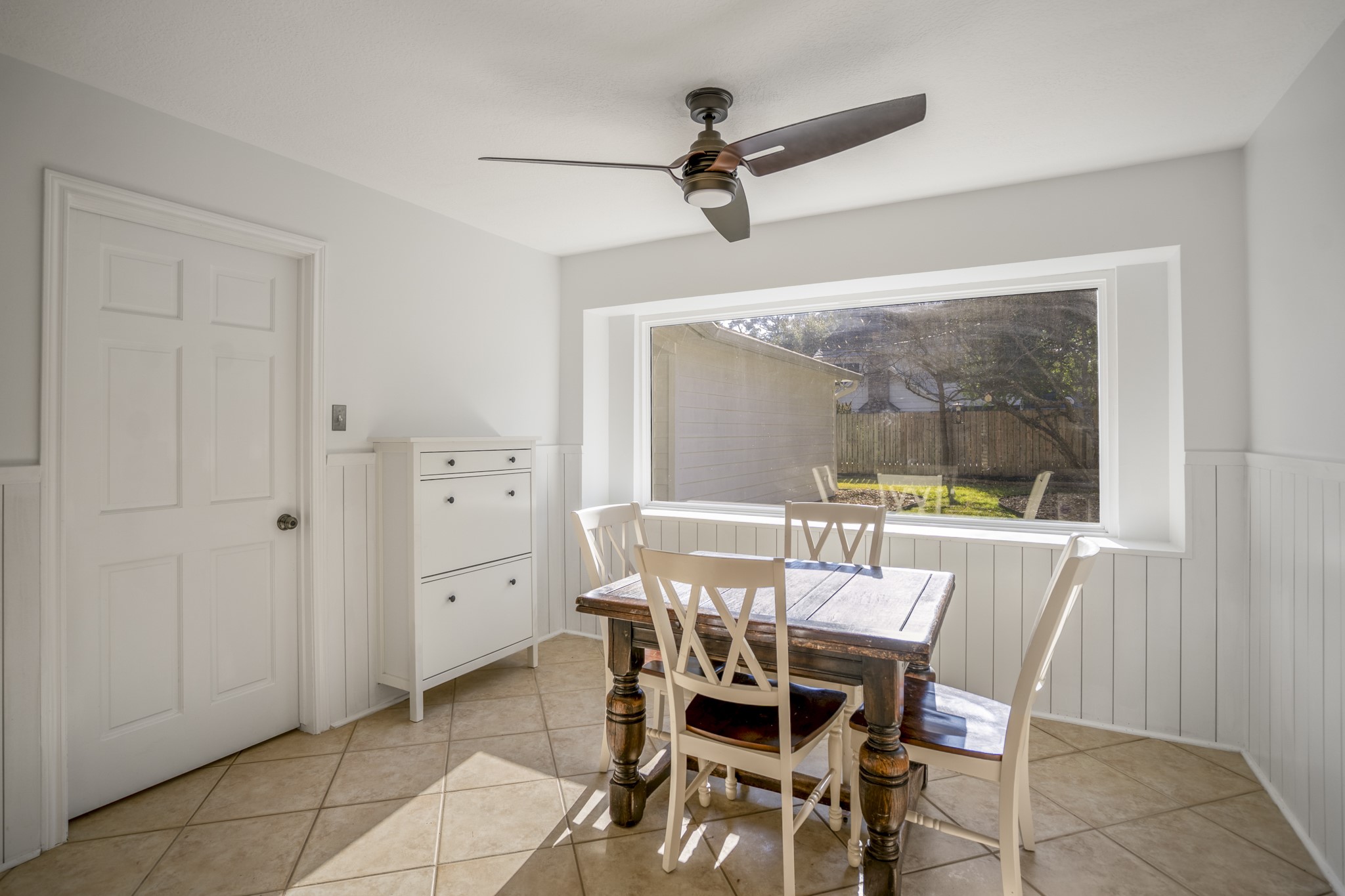 9507 Godstone Lane Spring, TX 77379 - Photo 15 of 42 The breakfast nook has a large picture window for breakfast with a view! The door to the left leads to the laundry room and back entrance to the home.