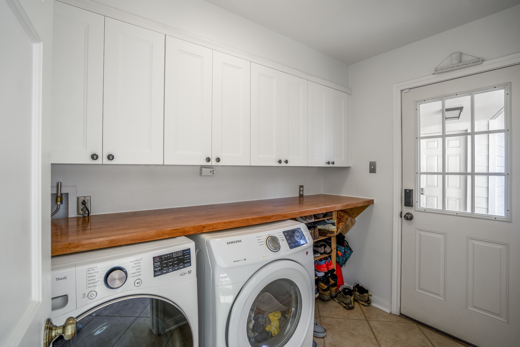 9507 Godstone Lane Spring, TX 77379 - Photo 18 of 42 The laundry room, with counter space and storage cabinets.