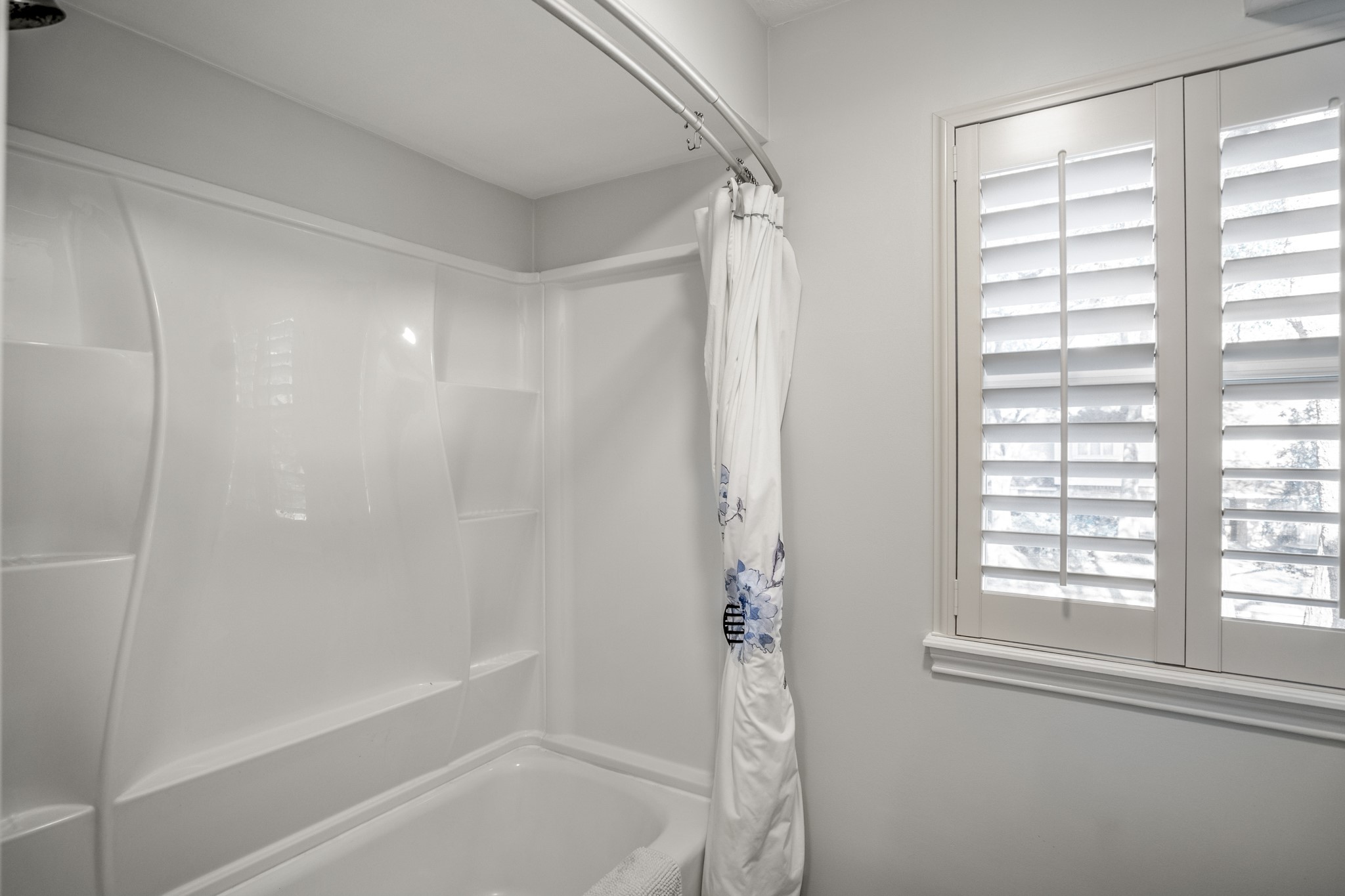 9507 Godstone Lane Spring, TX 77379 - Photo 30 of 42 More plantation shutters, as well as a renovated shower/tub.