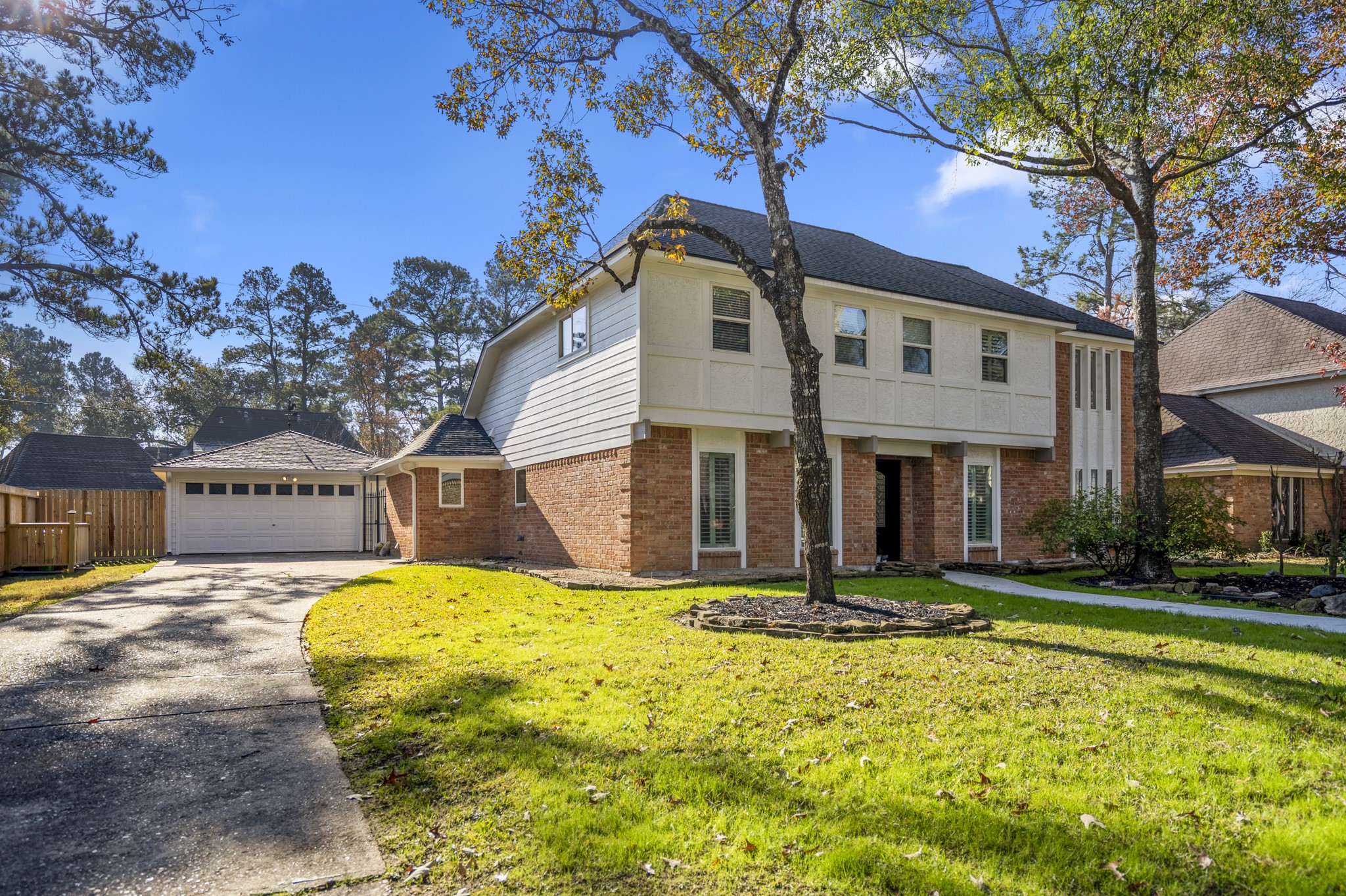 9507 Godstone Lane Spring, TX 77379 - Photo 3 of 42 A detached garage allows for a longer driveway.