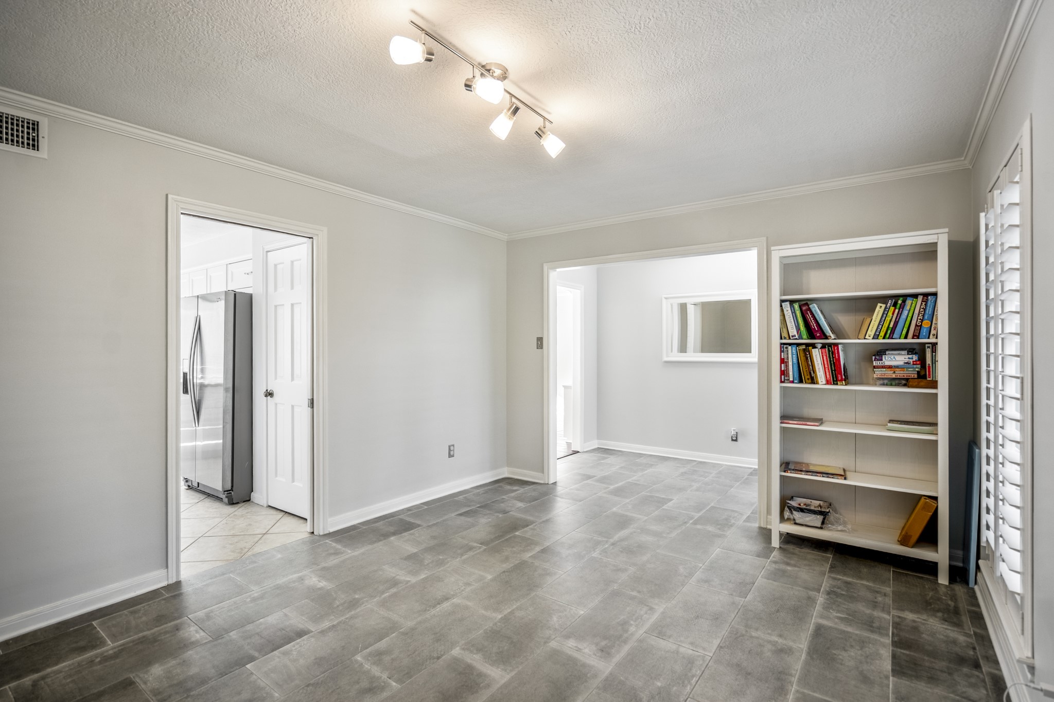 9507 Godstone Lane Spring, TX 77379 - Photo 7 of 42 Another view of the living/dining space, with plantation shutters.